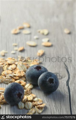Healthy Muesli And Fresh Berries on wooden table