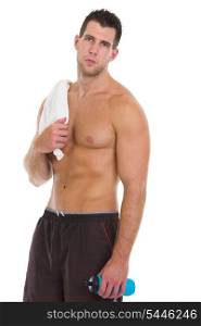 Healthy muscular man with towel and water bottle after workout