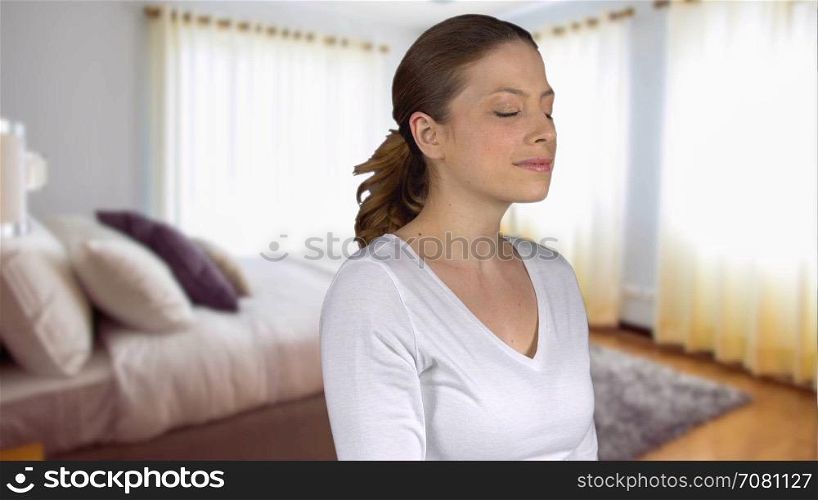 Healthy natural female stands in bedroom