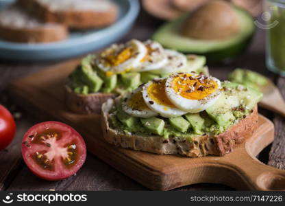 healthy nutrition and light breakfast - toast with avocado and egg