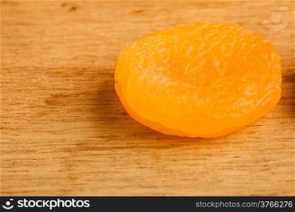 Healthy nutrition diet. Dried apricot on wooden table background.