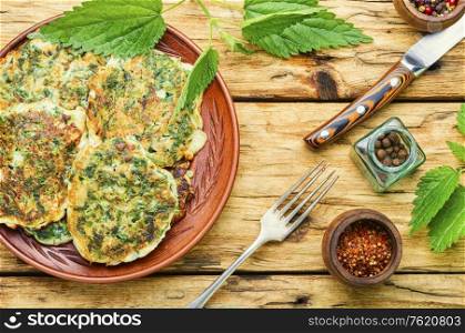 Healthy nutrition,diet fritters with nettles.Green pancakes with herbs. Diet fritters with nettles.
