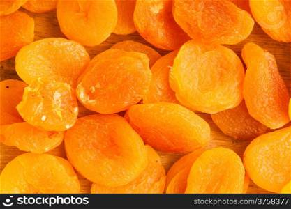 Healthy nutrition diet. Heap of dried fruits apricots close-up orange food background