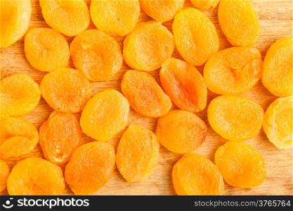 Healthy nutrition diet. Heap of dried fruits apricots close-up orange food background