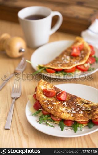 healthy nutrition. omelet with herbs, tomato and cheese