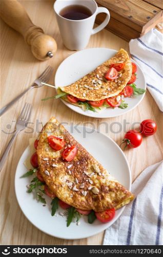 healthy nutrition. omelet with herbs, tomato and cheese
