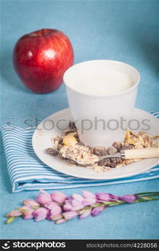 Healthy nutrition with fresh milk and a red apple