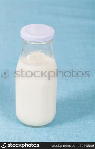 Healthy nutrition with fresh milk in a glass bottle