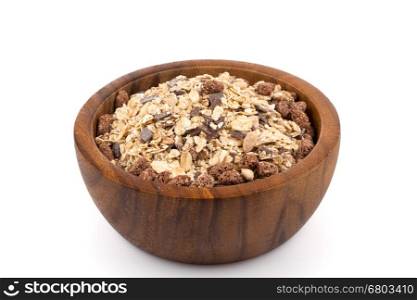 Healthy oat granola muesli cereals with chocolate in a bowl on white