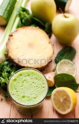 healthy organic green detox juice on wood