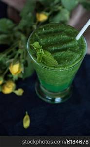 Healthy organic green smoothie. Healthy organic green smoothie with basil mint and lemon