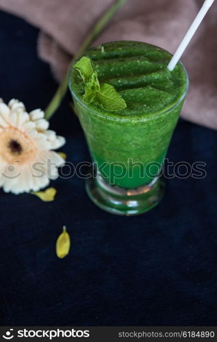 Healthy organic green smoothie. Healthy organic green smoothie with basil mint and lemon