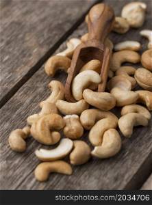 healthy raw cashew nuts small wooden spoon