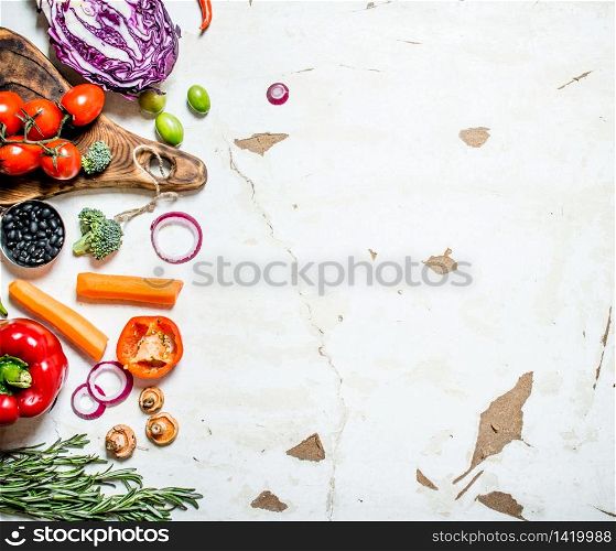 Healthy raw food . Fresh organic vegetables with herbs. On rustic background. Healthy raw food . Fresh organic vegetables with herbs.