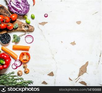Healthy raw food . Fresh organic vegetables with herbs. On rustic background. Healthy raw food . Fresh organic vegetables with herbs.