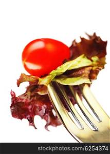Healthy salad on the silver fork isolated on white background, conceptual image of healthy eating &amp; diet