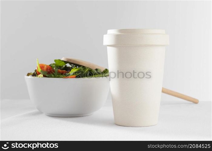 healthy salad white bowl with paper cup coffee