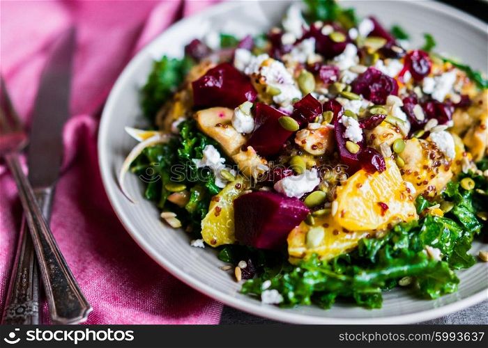 Healthy salad with grilled chicken,kale.beets and goat cheese