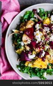 Healthy salad with grilled chicken,kale.beets and goat cheese