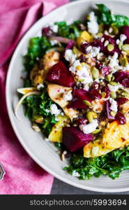 Healthy salad with grilled chicken,kale.beets and goat cheese