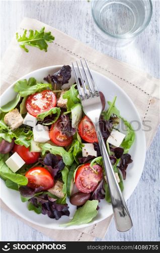 healthy salad with tomatoes olives and feta cheese