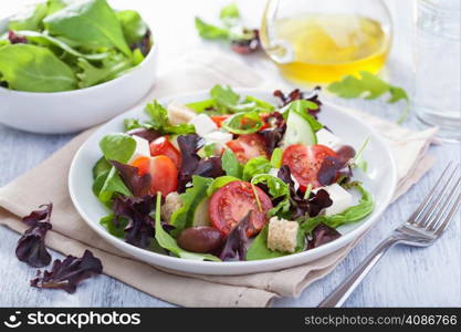 healthy salad with tomatoes olives and feta cheese