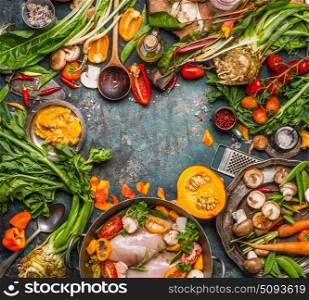 Healthy seasonal food ingredients for tasty clean cooking and eating: organic vegetables,Mushrooms, pumpkin, roots and chicken on vintage background, top view, frame