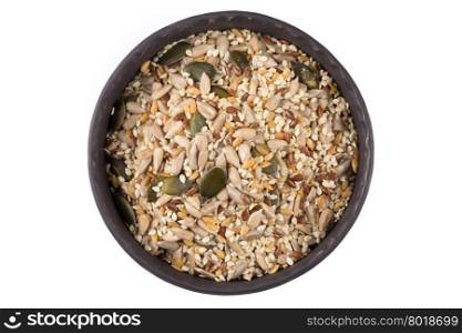 Healthy seeds mix in a stone bowl on white background