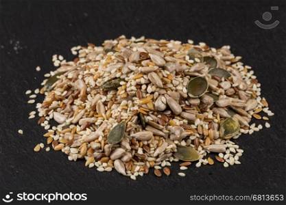 Healthy seeds mix on a stone background