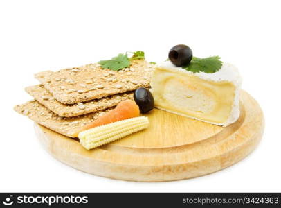 Healthy snacks with fresh Brie cheese, organic crackers and baby corn. Isolated on white background. . Brie cheese and crackers