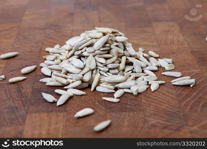 Healthy sun flower seeds on a wooden bg