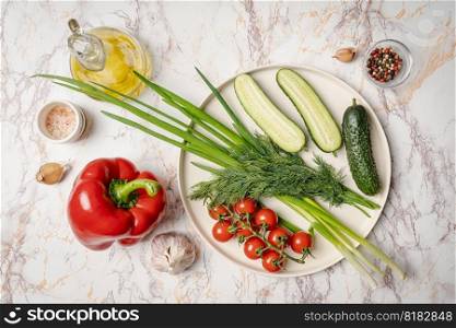Healthy vegan food assortment. Organic vegetarian food ingredients vegetables on white plate, copy space, top view. Clean vegan eating and detox concept.. Healthy vegan food assortment.