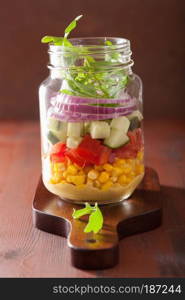 healthy vegetable salad in mason jar