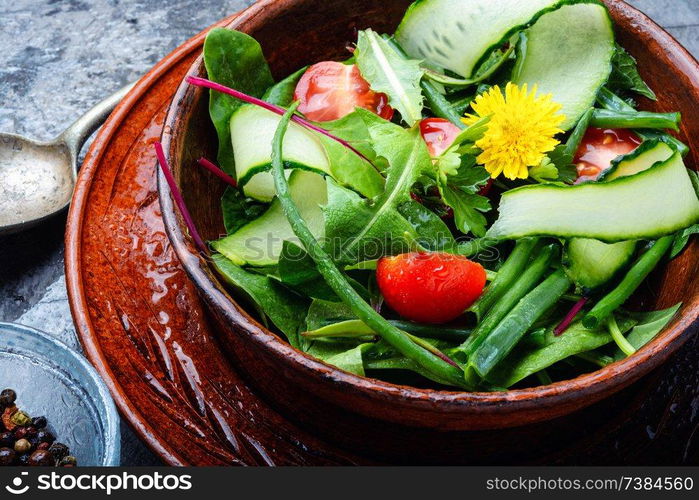 Healthy vegetable salad of fresh tomato, cucumber, herb and lettuce.Healthy food. Fresh mixed green salad