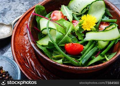 Healthy vegetable salad of fresh tomato, cucumber, herb and lettuce.Healthy food. Fresh mixed green salad
