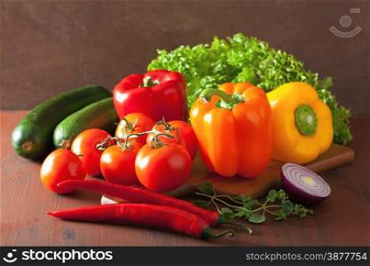 healthy vegetables pepper tomato salad onion chilli on rustic background