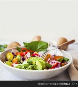 Healthy vegetables salad bowl closeup with copy space, fresh organic vegetables salad 
