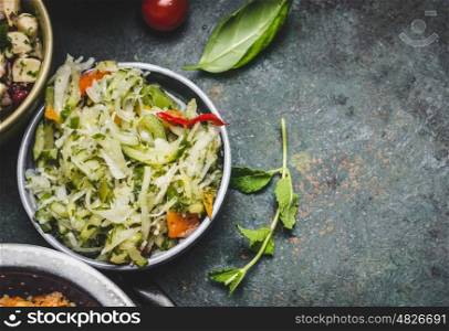 Healthy vegetarian Cabbage salad in bowl on rustic background, top view, close up, border. Diet eating, Vegetarian or vegan food concept