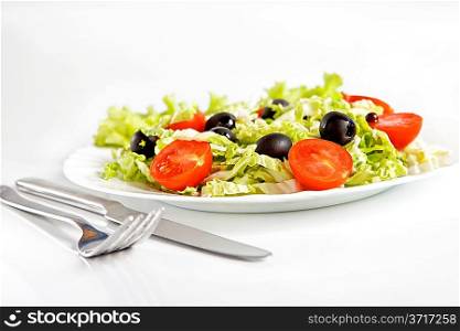 Healthy vegetarian salad isolated on white