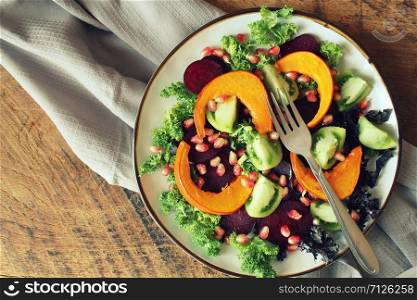 Healthy vegetarian salad, roasted pumpkin, tomato,pomegranate, kale, beet .. Healthy vegetarian salad, roasted pumpkin, tomato,pomegranate, kale, beet