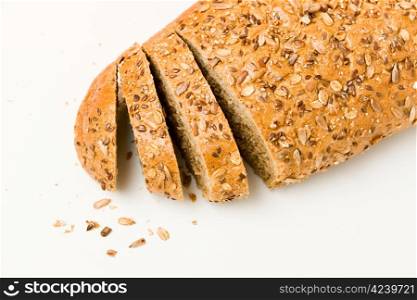 Healthy whole grain bread and slices on the white background.