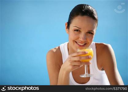 Healthy woman drinking orange juice