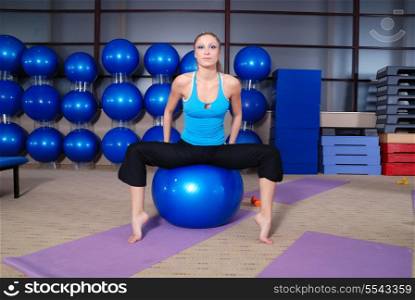healthy woman exercising in fitness club