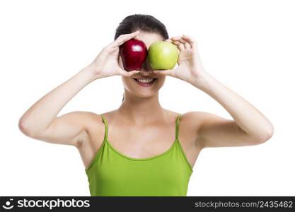 Healthy woman holding a fresh apple in front of her eyes, isolated over a white