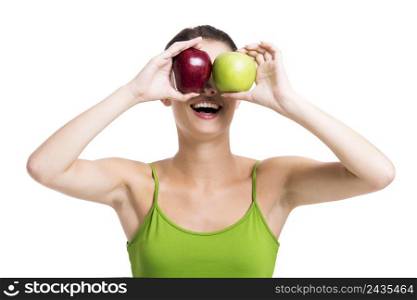 Healthy woman holding a fresh apple in front of her eyes, isolated over a white