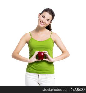 Healthy woman holding a fresh apple in front of the belly, isolated over a white