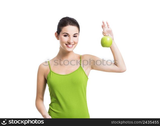 Healthy woman holding a fresh apple, isolated over a white background