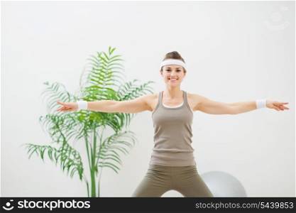 Healthy woman making gymnastics