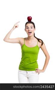 Healthy woman pointing to a apple over her head, isolated in white background