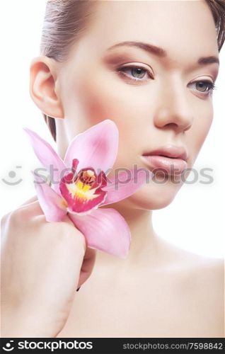 healthy woman with clean skin and flower on white background